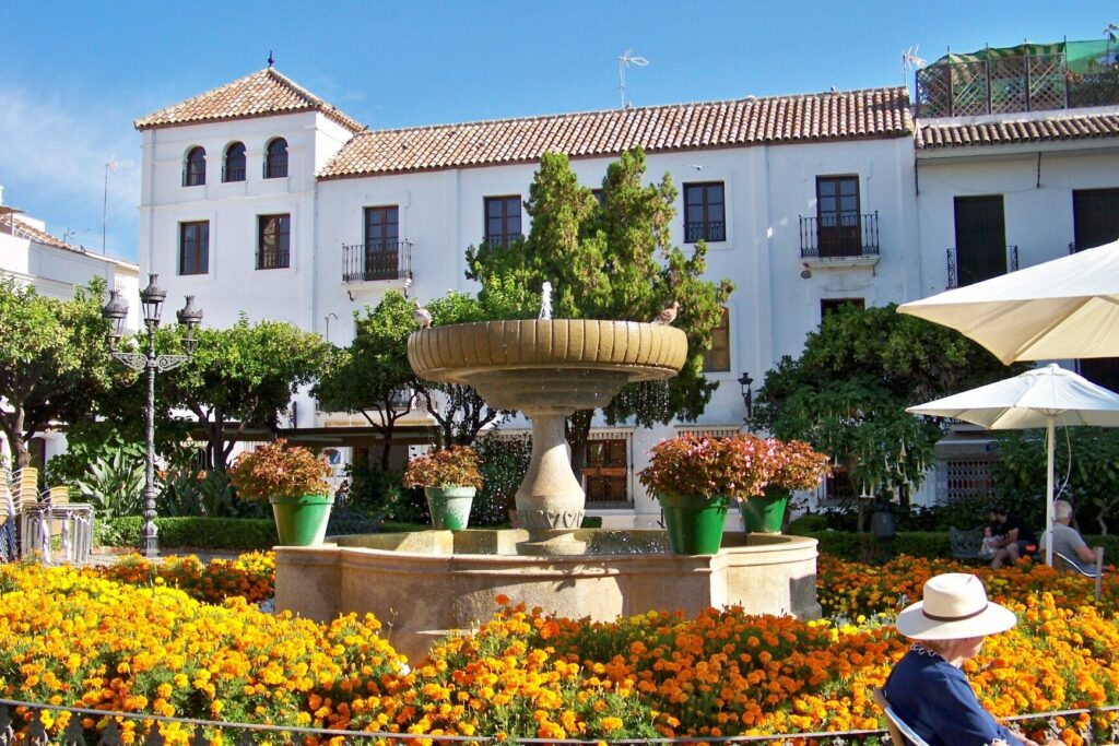View of Estepona old town with floral facades and pedestrian streets