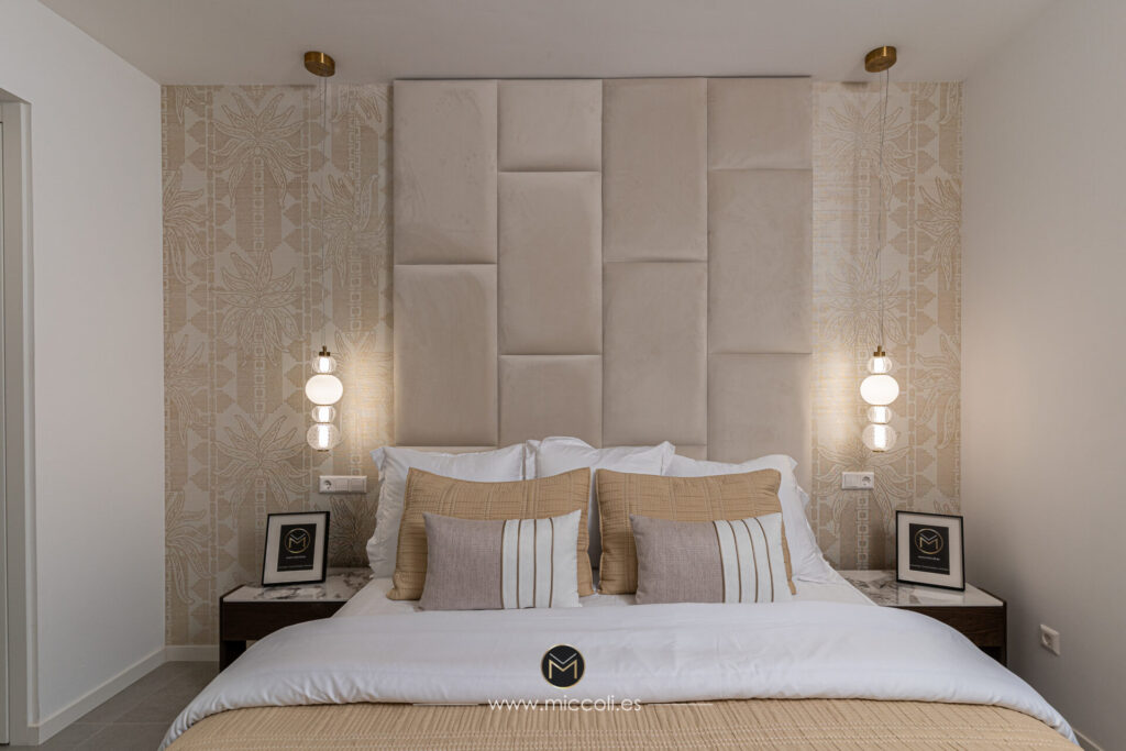 Double bedroom with a tall padded headboard and pendant lights at Culmia Sunset, Estepona.