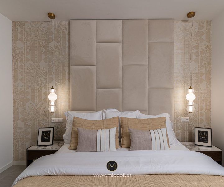 Double bedroom with a tall padded headboard and pendant lights at Culmia Sunset, Estepona.